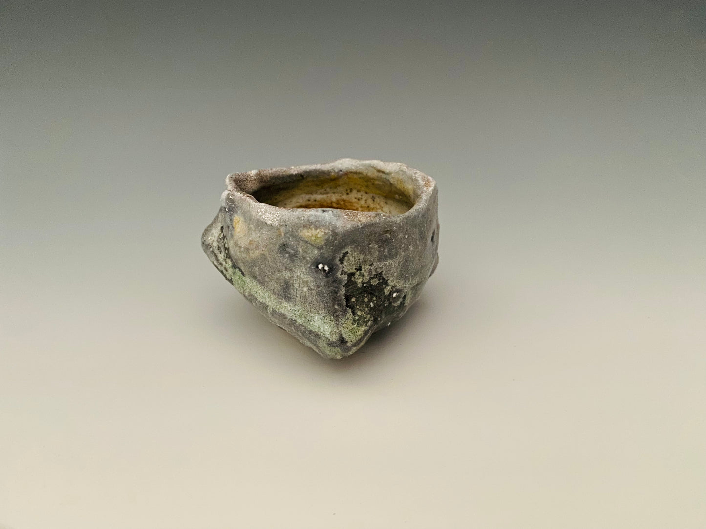 Wood fired sake cup, porcelain clay.