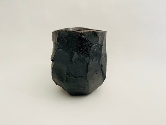 Wood fired faceted cup, black clay.