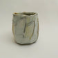 Wood fired faceted porcelain cup