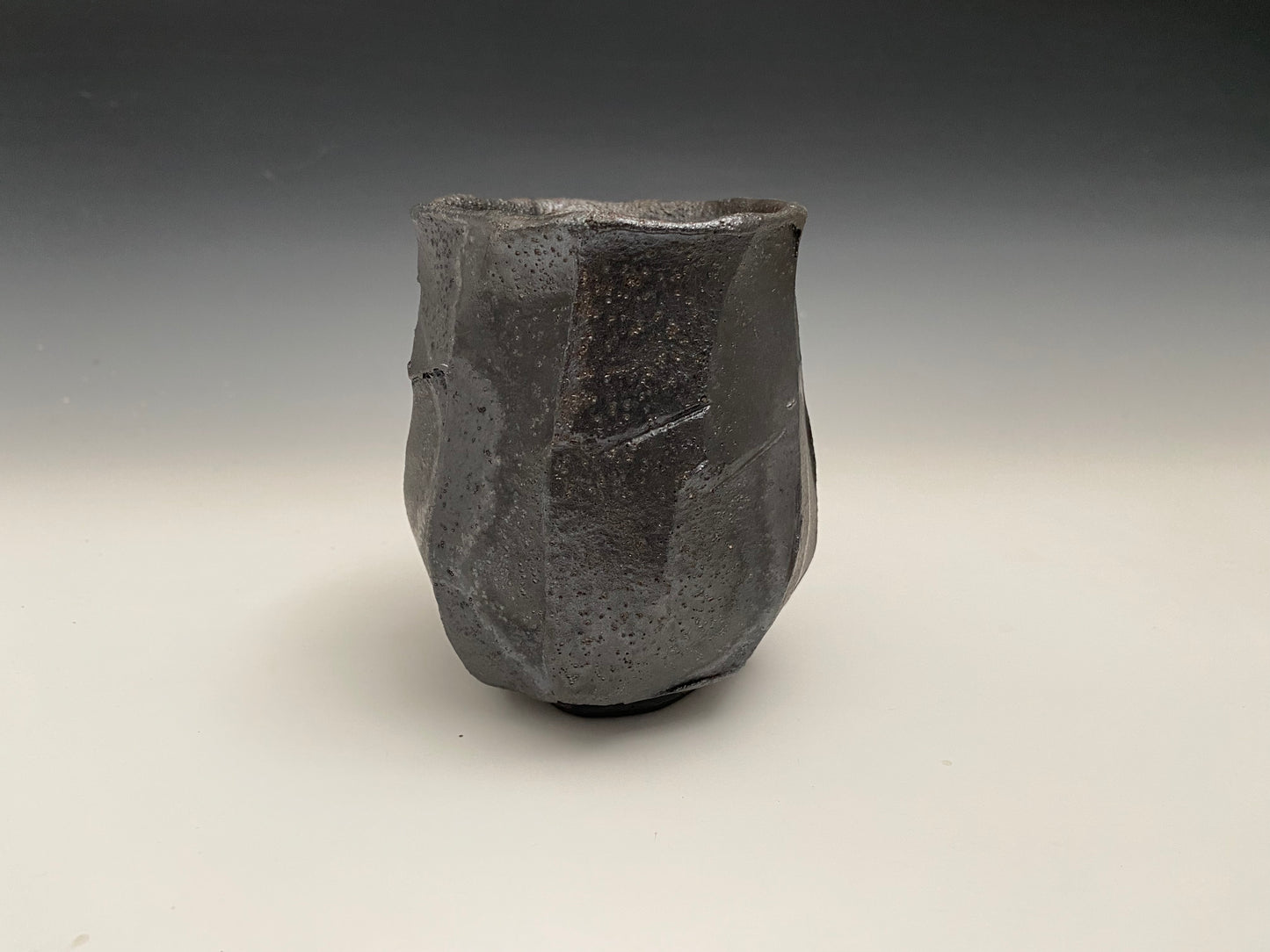 Faceted black clay cup