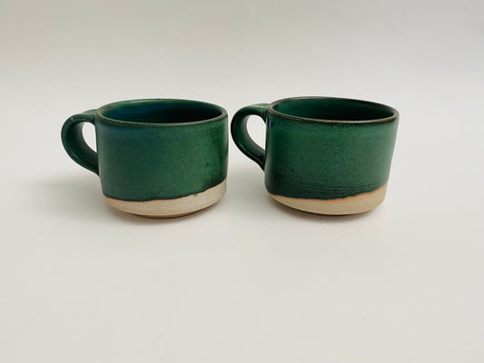 A pair of forest green espresso cups