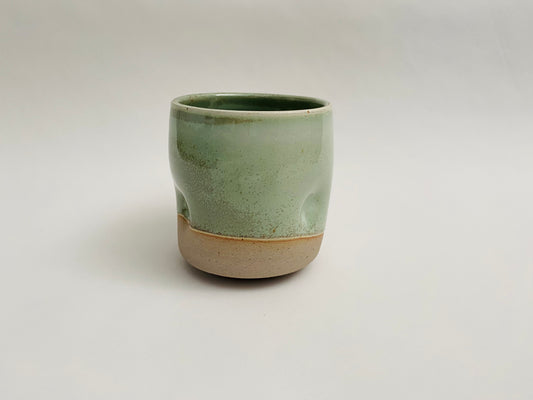 Light green tumbler with dimples