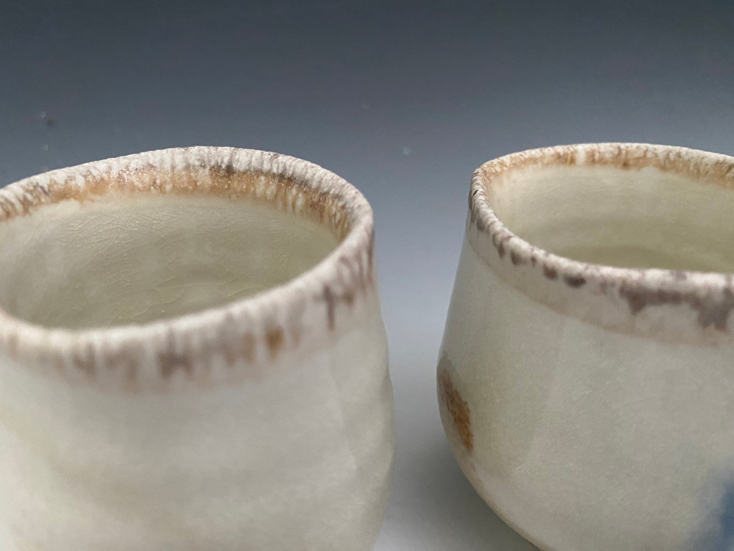A pair of small wood fired sipping cups