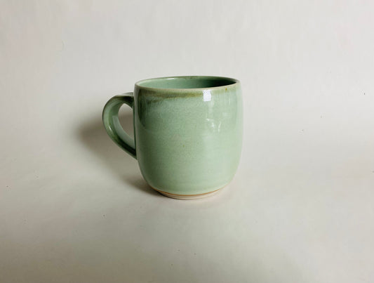 Medium Size Porcelaneous Mug with a Light Green Glaze