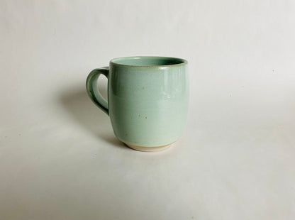 Medium Size Porcelaneous Mug with a Light Green Glaze