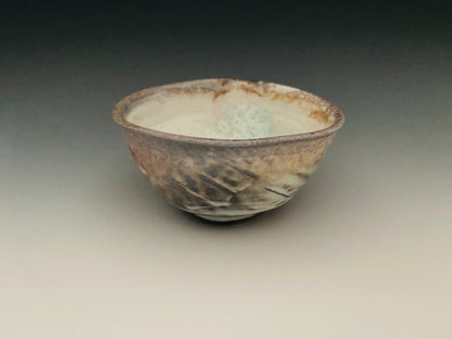 Wood fired porcelain bowl with paddle marks