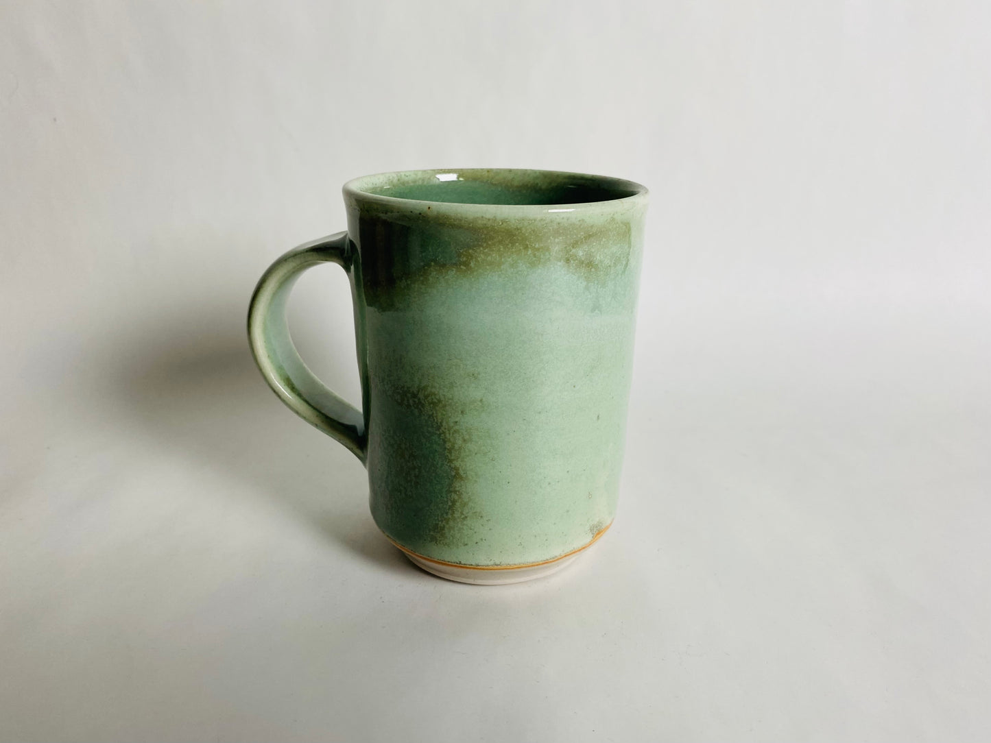 Tall Mug with a Light Green Glaze