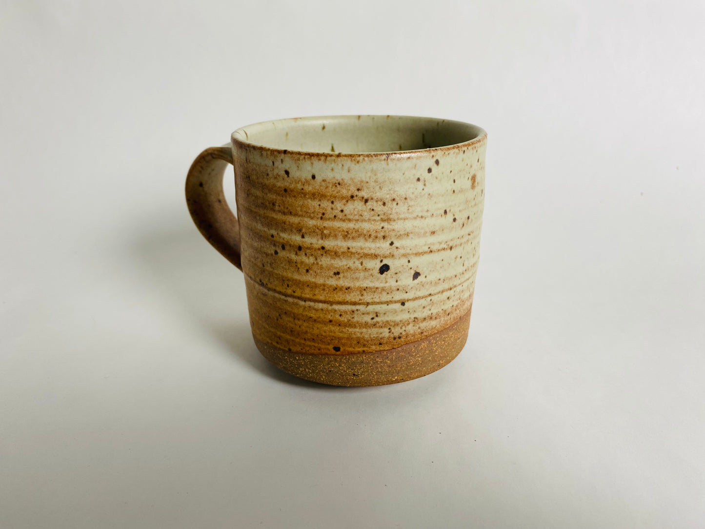 Oatmeal mug with bare clay accent