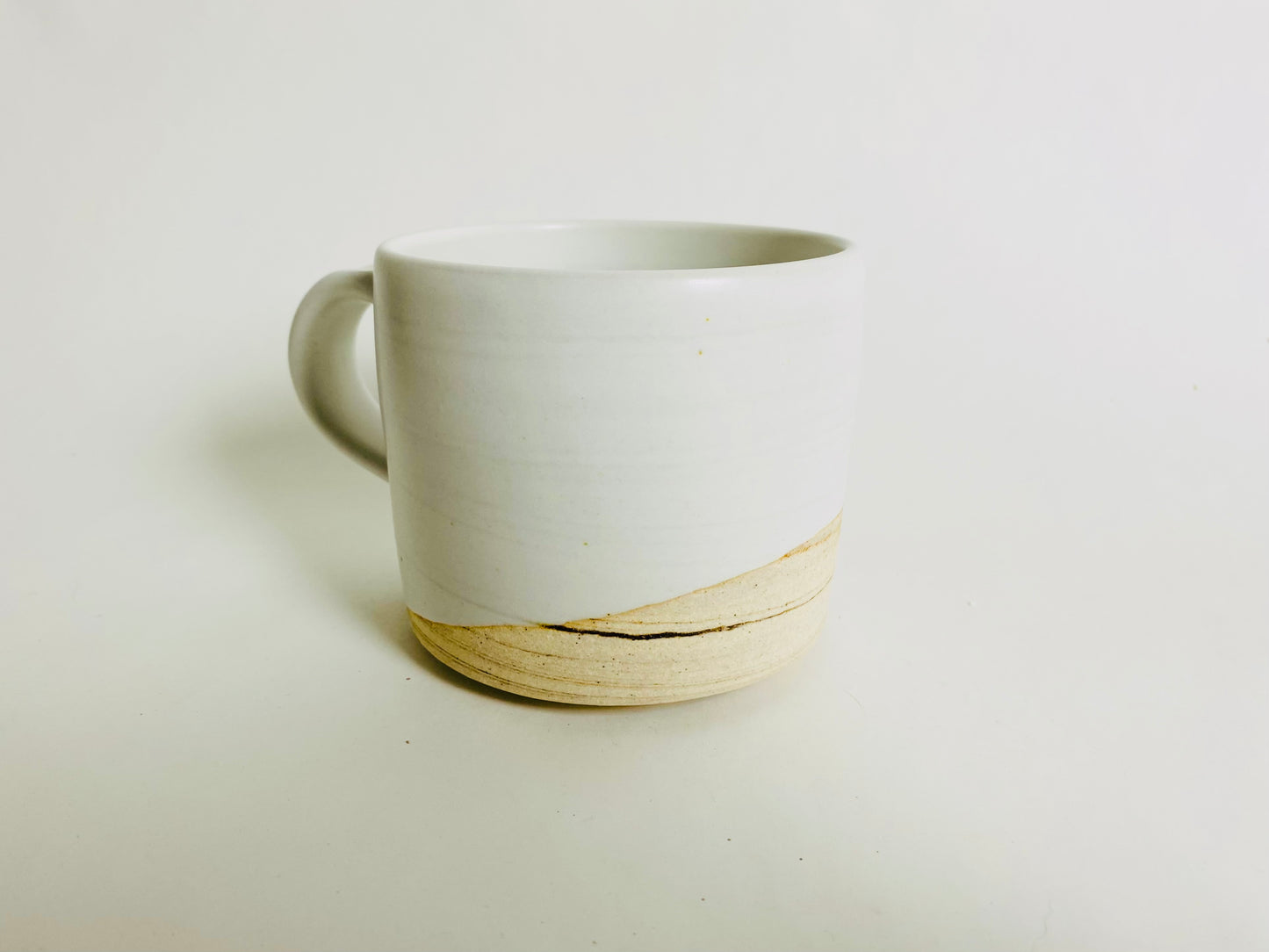 White glazed mug with marbleized clay