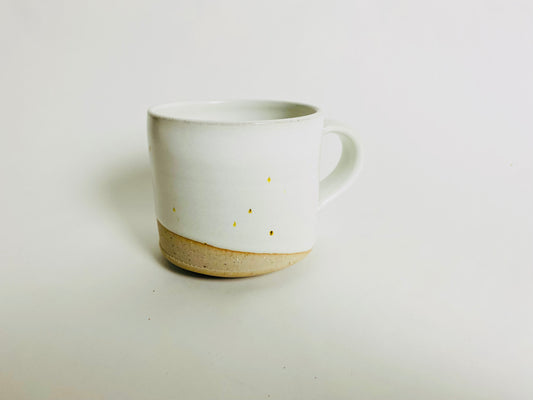 Small mug, white glaze with bare clay accent