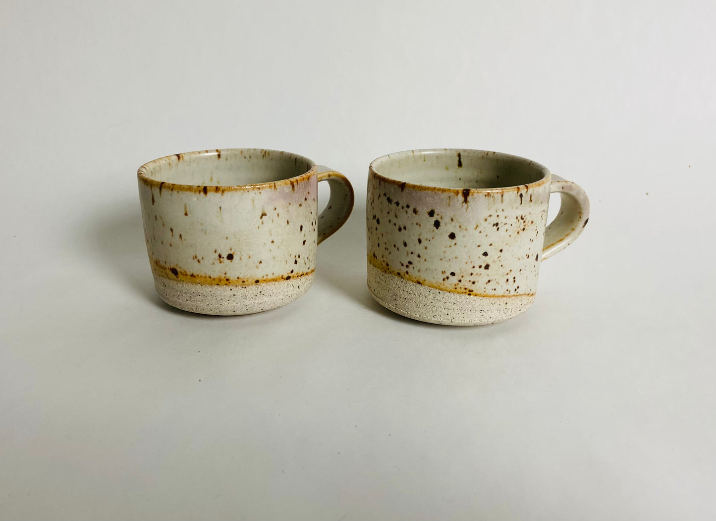 A pair of speckled espresso cups