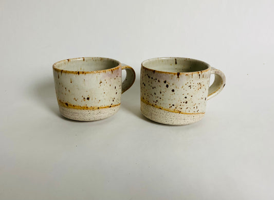 A pair of speckled espresso cups