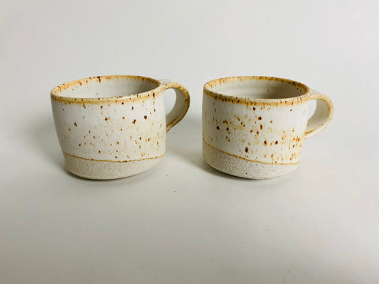 A pair of speckled espresso cups