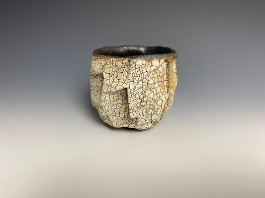 Wood fired faceted yunomi with crackle slip.