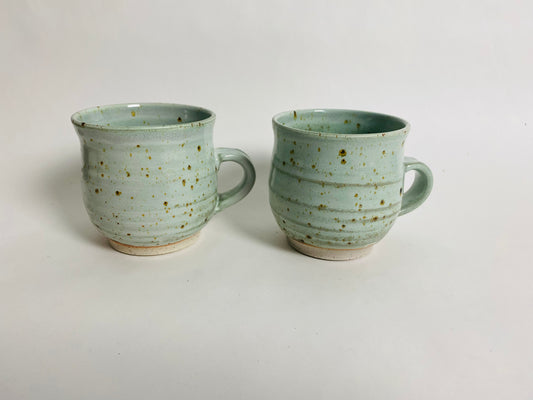 A Pair of Speckled Green Mugs