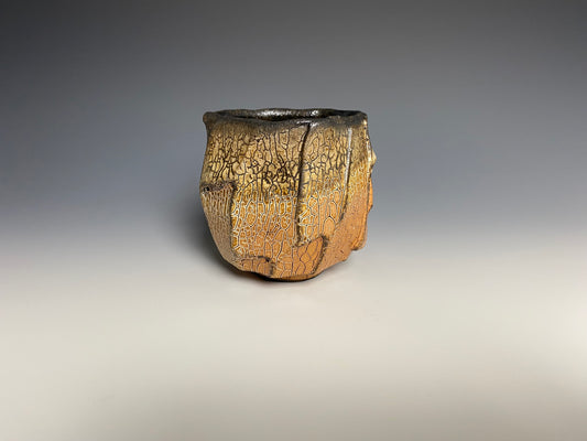 Wood fired faceted yunomi with crackle slip, black clay. (Copy)