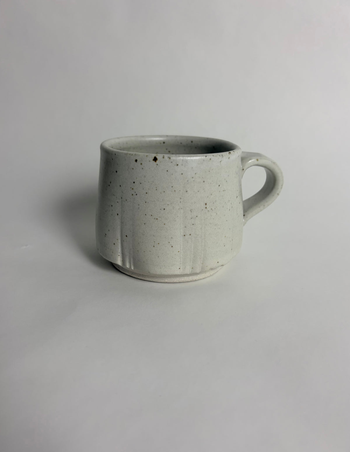 Mug with a Speckled Off White Glaze and Lines