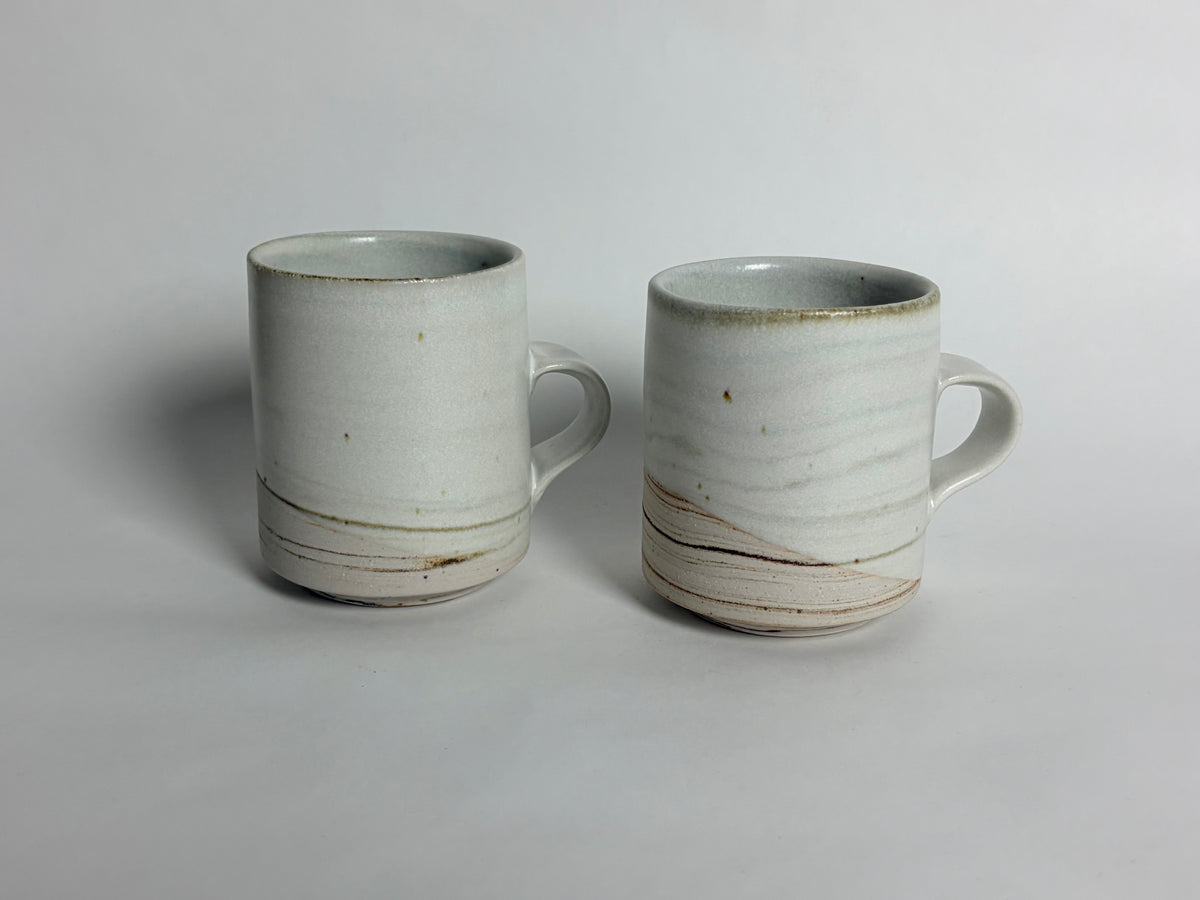 A Pair of Small Marbleized Mugs
