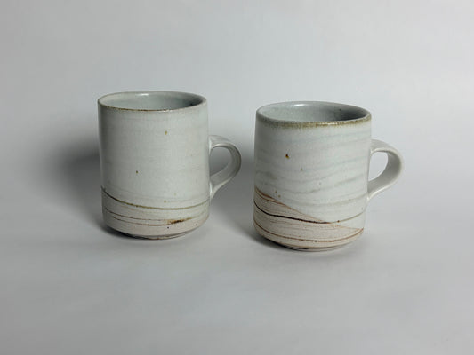 A Pair of Small Marbleized Mugs