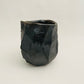 Wood fired faceted cup, black clay.
