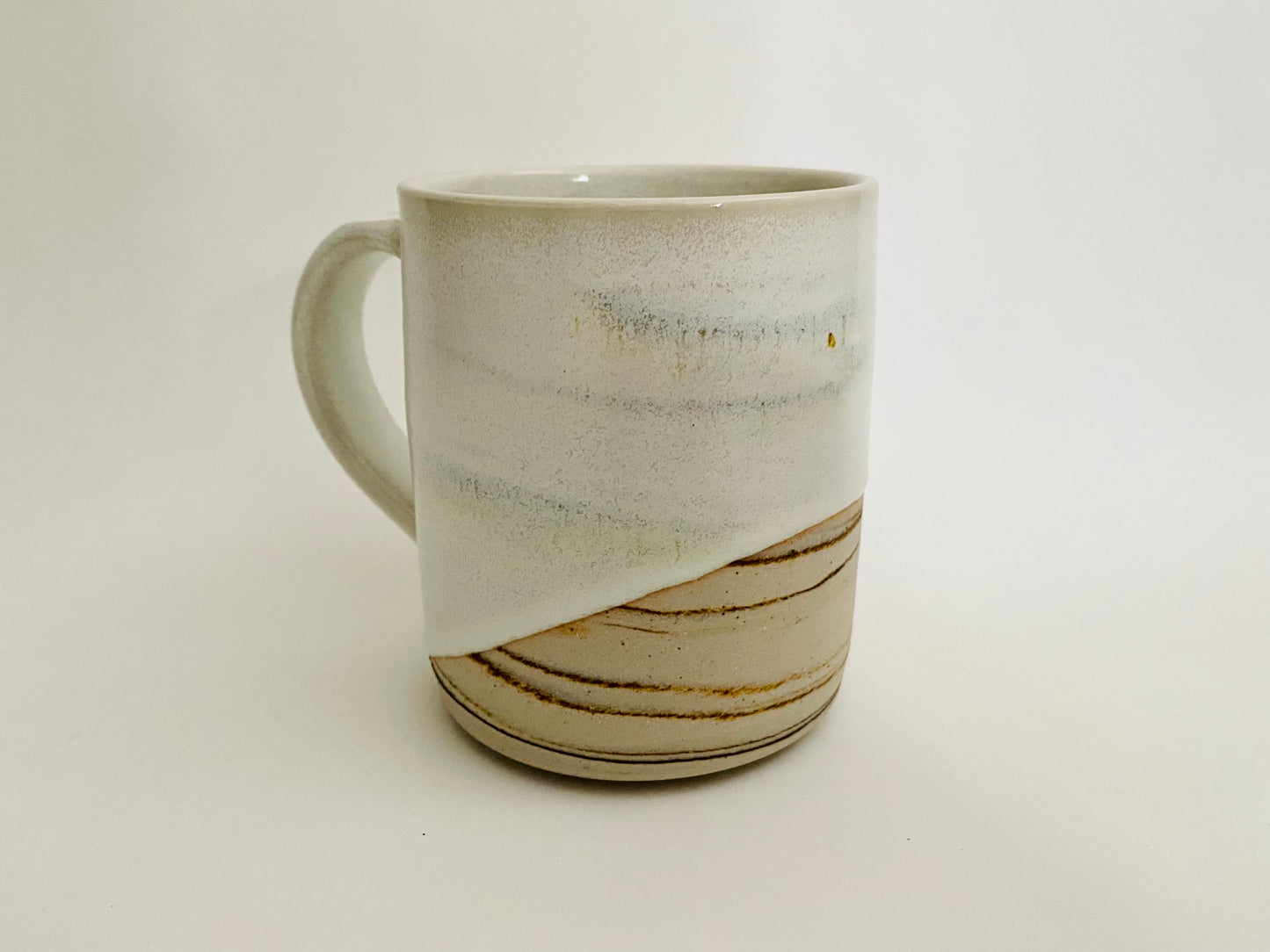 Mug in white glaze with marbleized clay