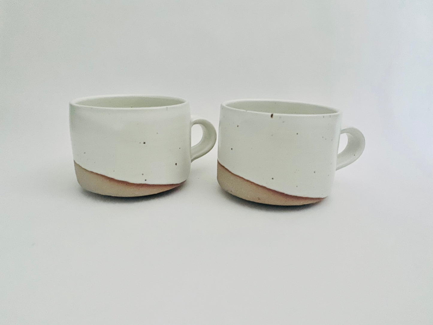 A pair of stoneware mugs