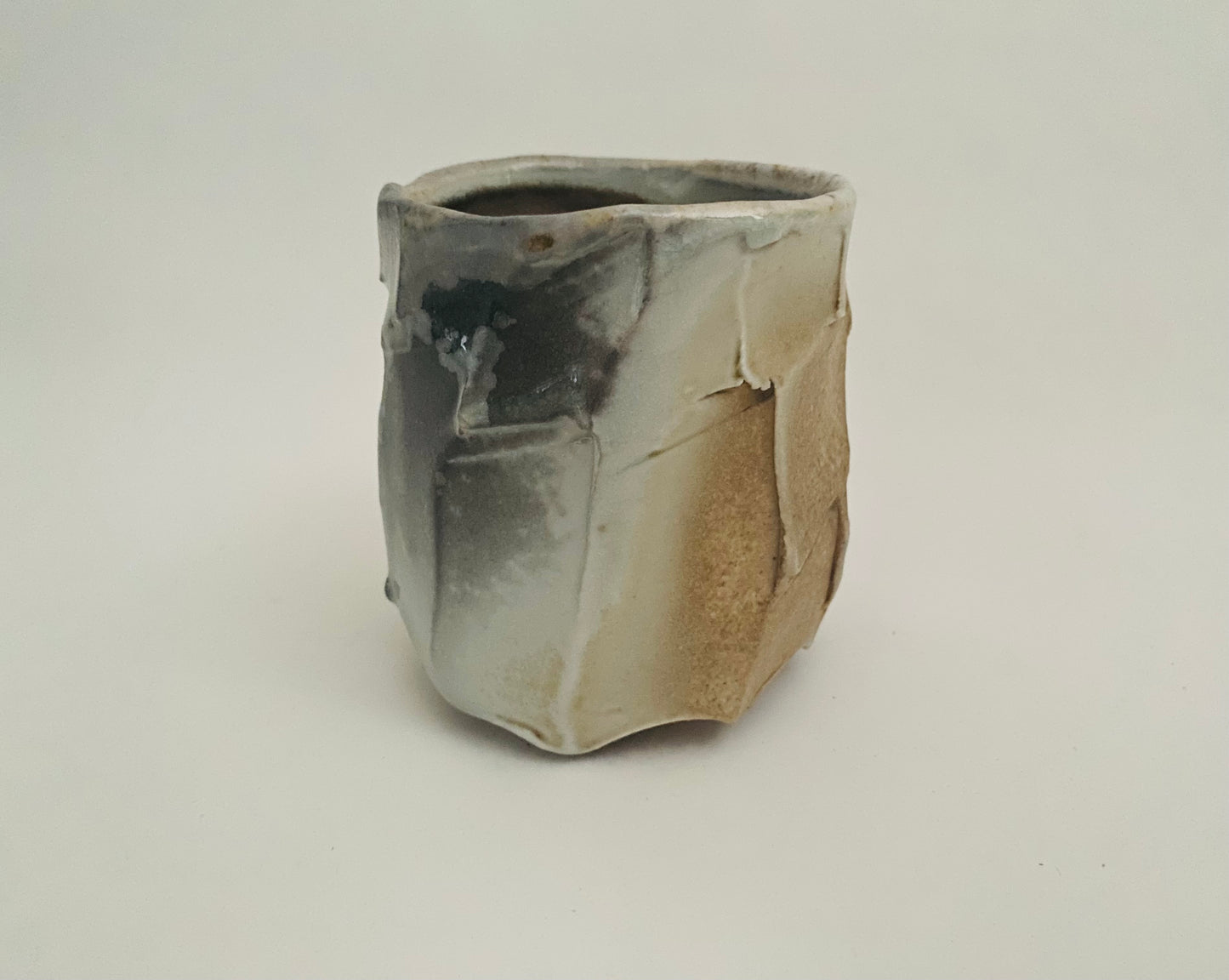 Wood fired porcelain faceted cup
