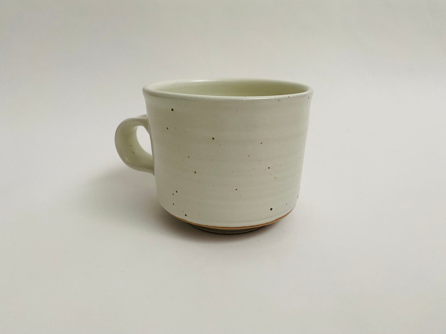 Stoneware mug in white glaze with marbleized clay