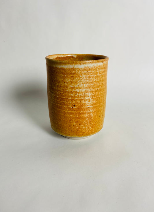 Tumbler with an Orange Glaze